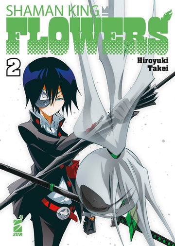 Copertina di "Shaman King Flowers 2" edizione Star Comics, mostra il titolo e dettagli artistici sulla copertina del fumetto.